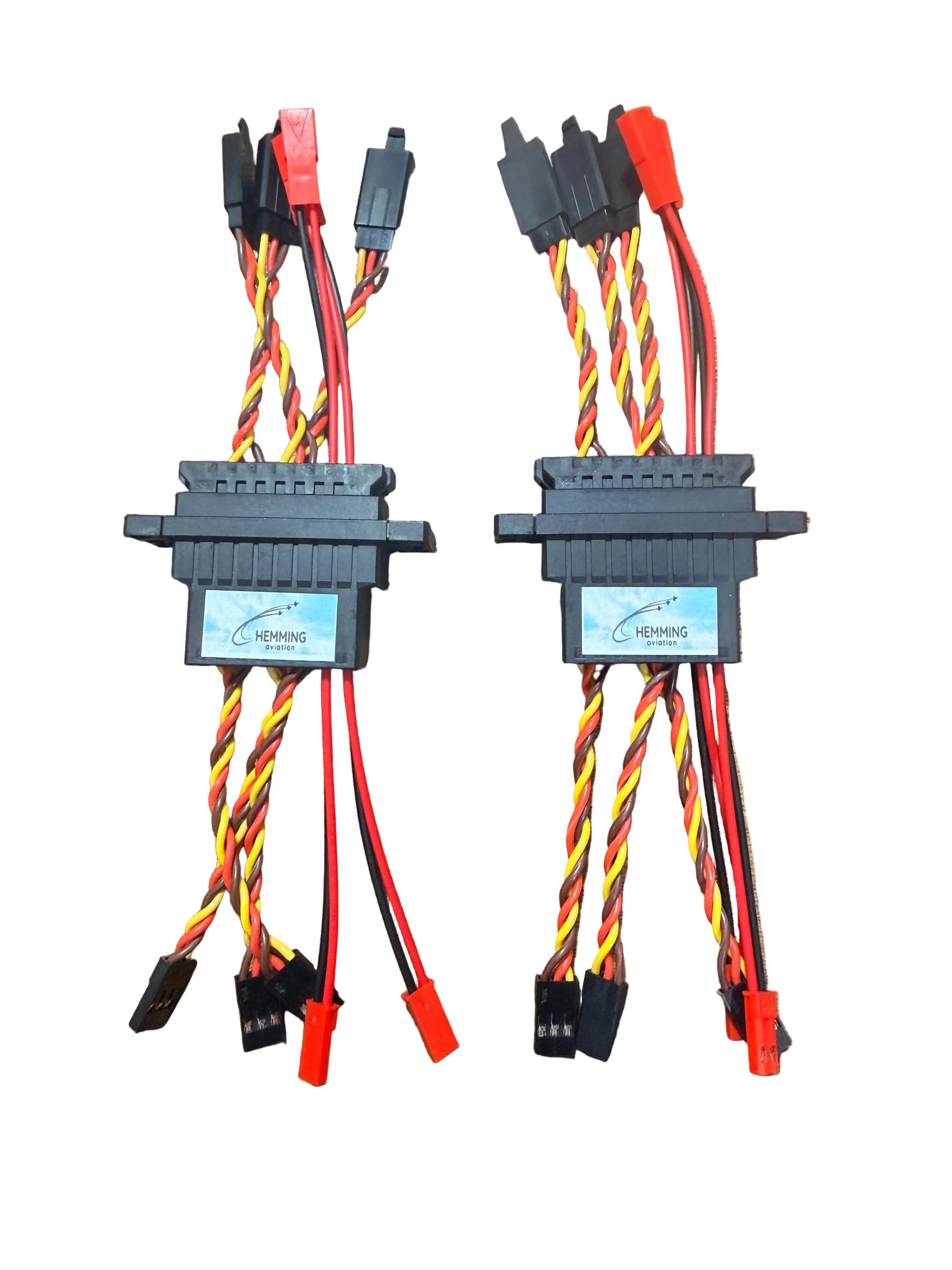 Two sets of cables with connectors on a white surface
